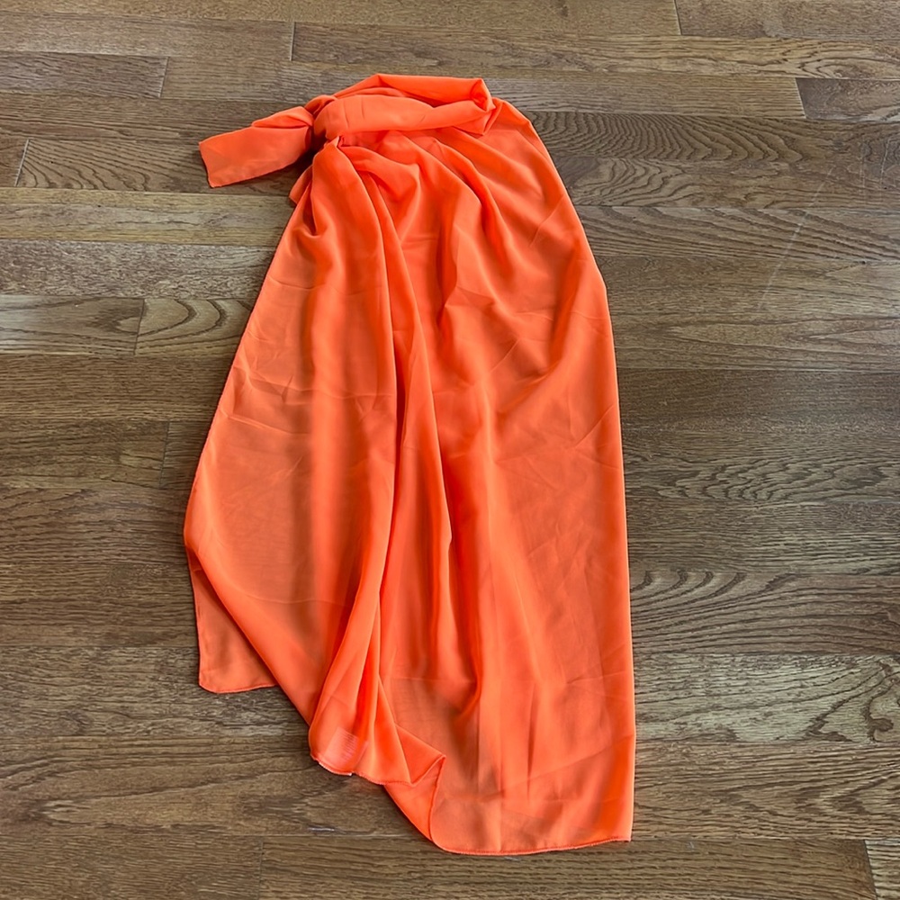 Long orange sheer sarong coverup can be tied many different ways